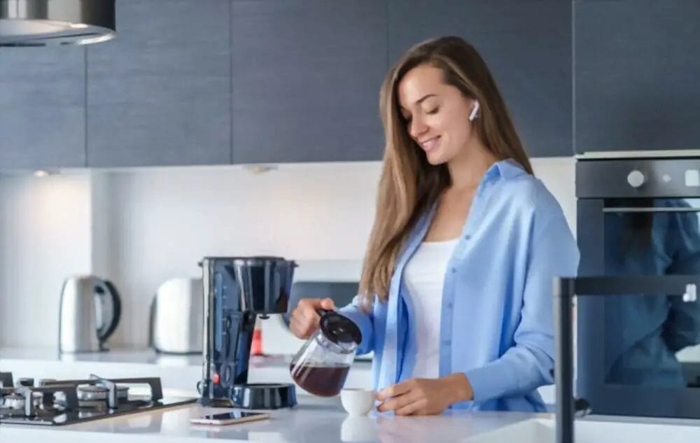 Woman Making Coffee Which Nespresso Machine Has Bluetooth?