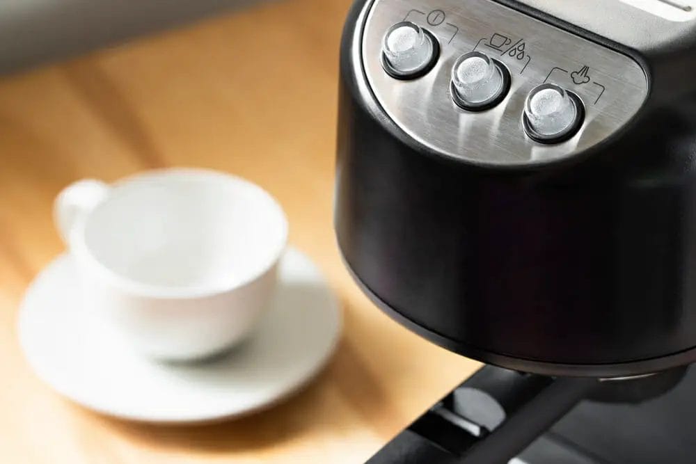 How do you reset the clean light on a coffee maker?