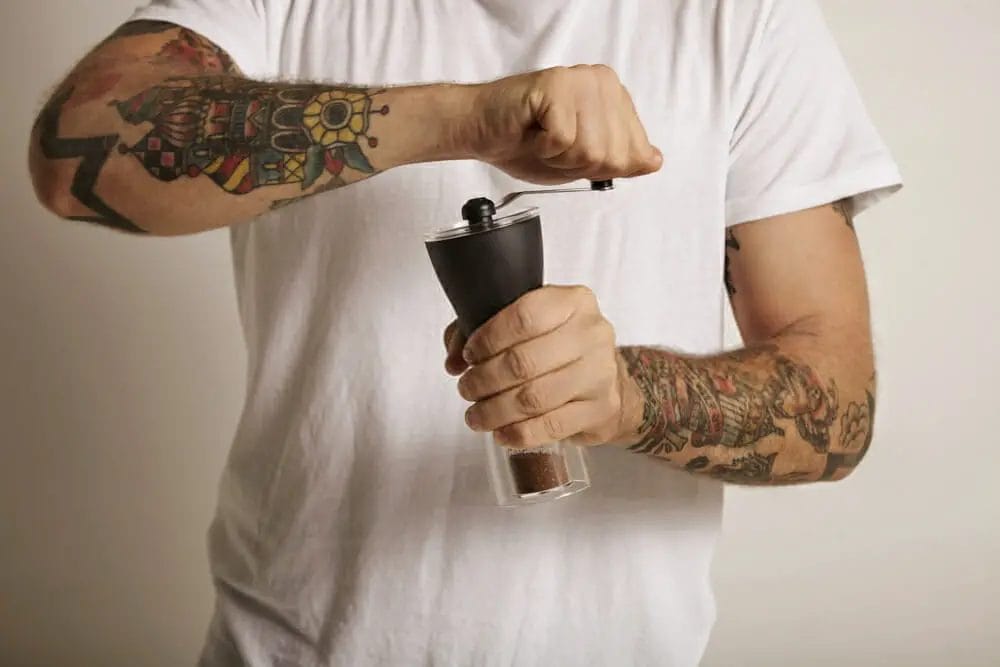 How do you use a hand crank grinder?
