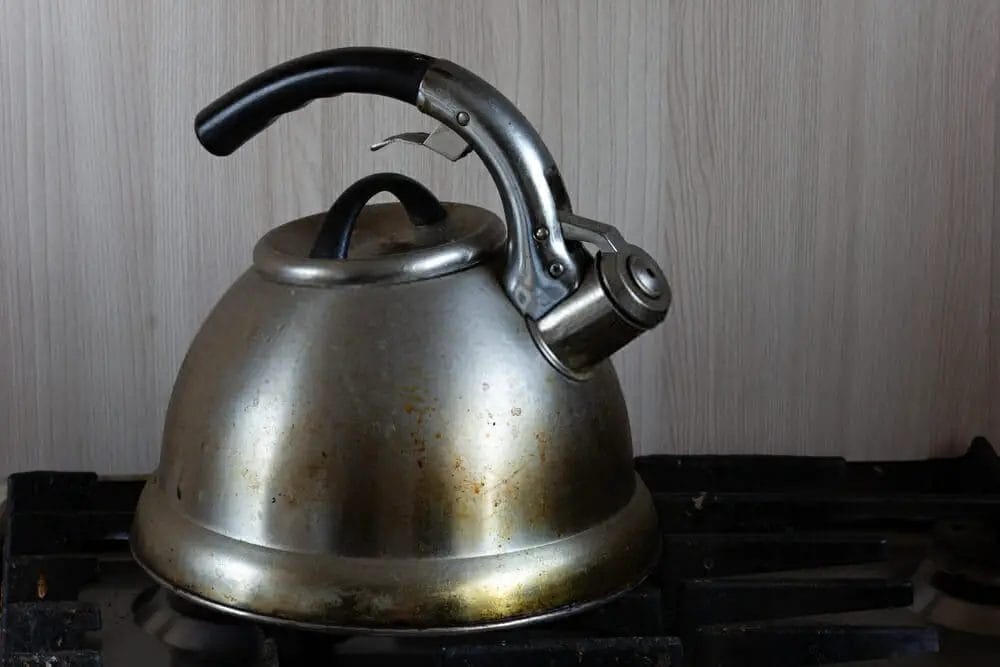 How do you remove tea stains from a tea maker?