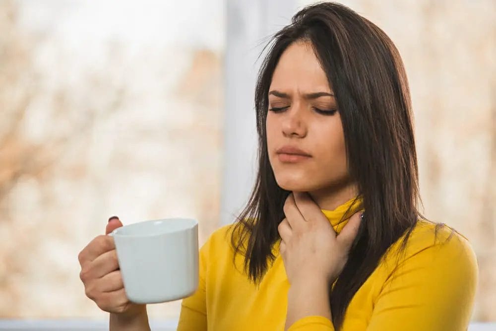 How do I get rid of a sore throat quickly?